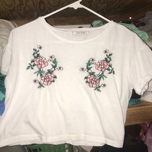 white tee. with two flowers embroidered